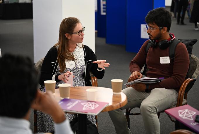 Two people chatting together