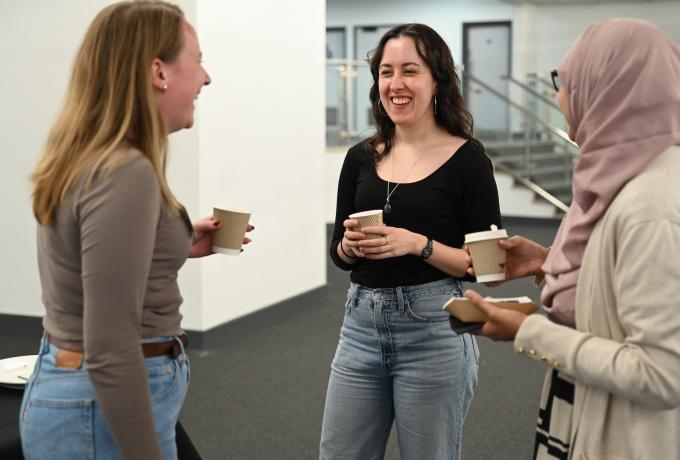 Three people chatting together