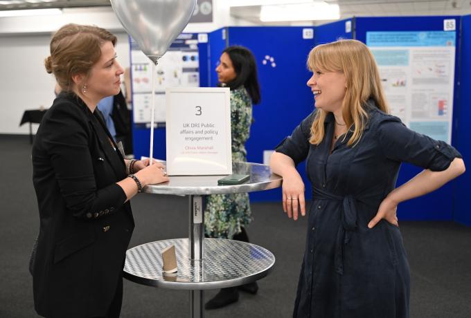 Two people chatting together