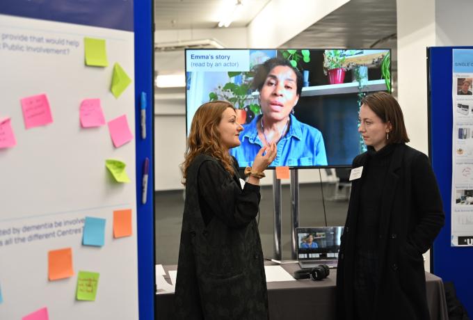 Two people chatting together