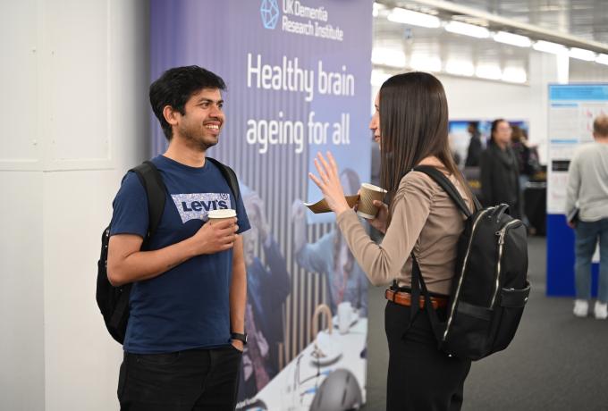 Two people chatting together