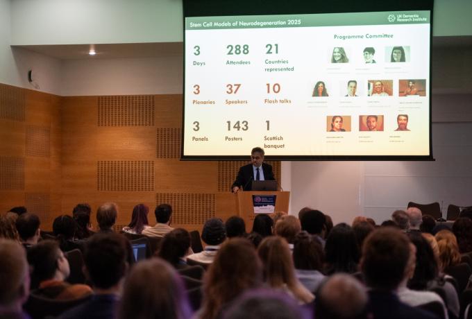 Prof Siddharthan Chandran presenting on stage at SCMND