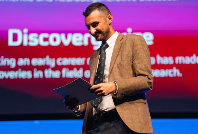 A researcher receiving his award