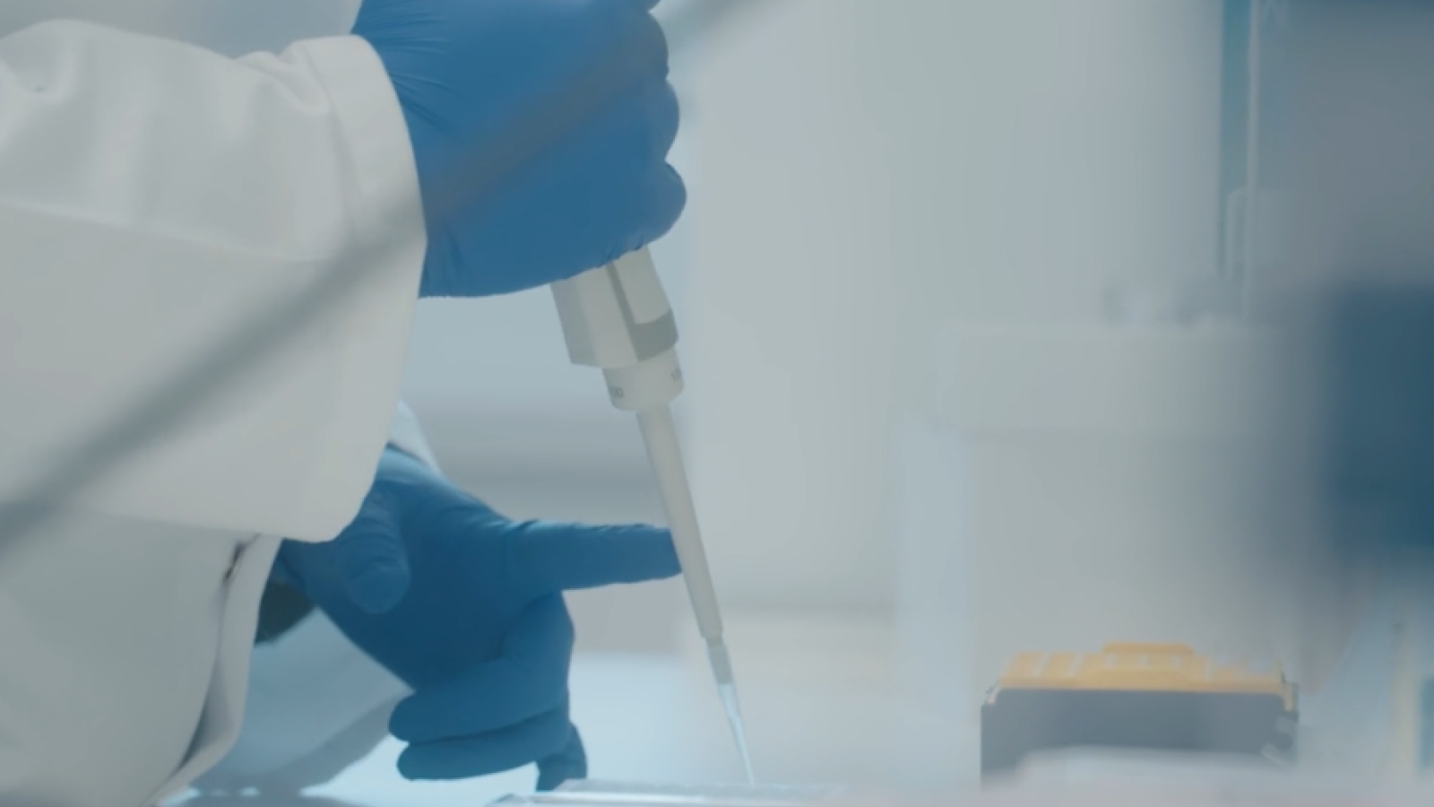 A person pipetting