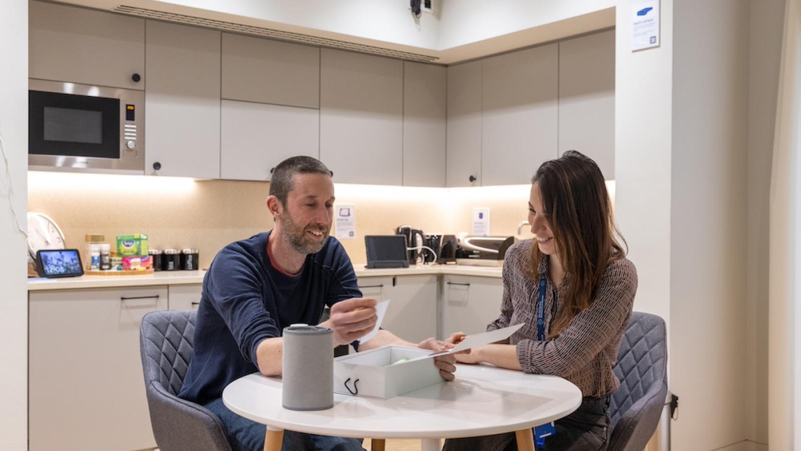 Two people sit at a table