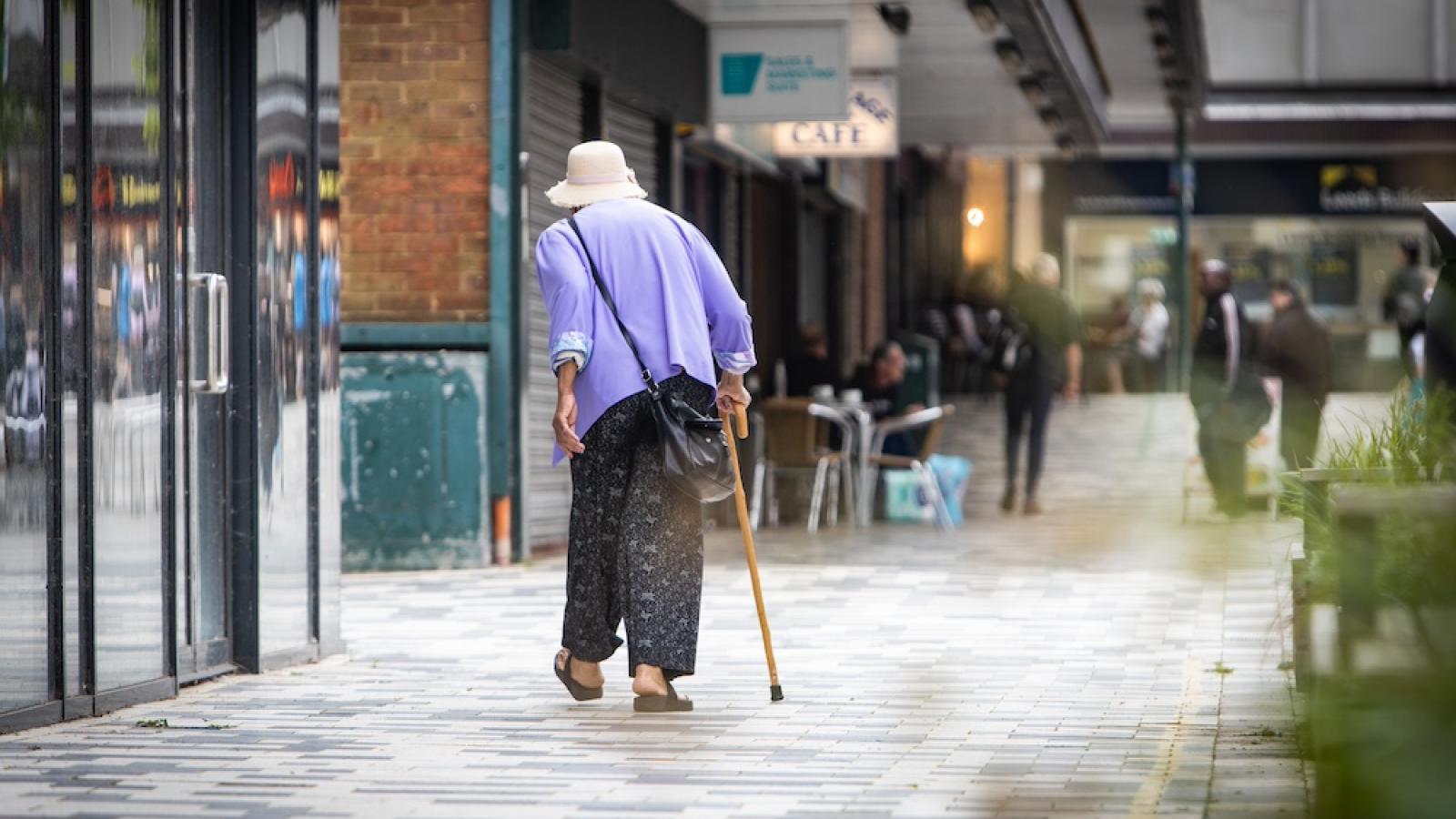 Elderly woman walking in a shopping centre