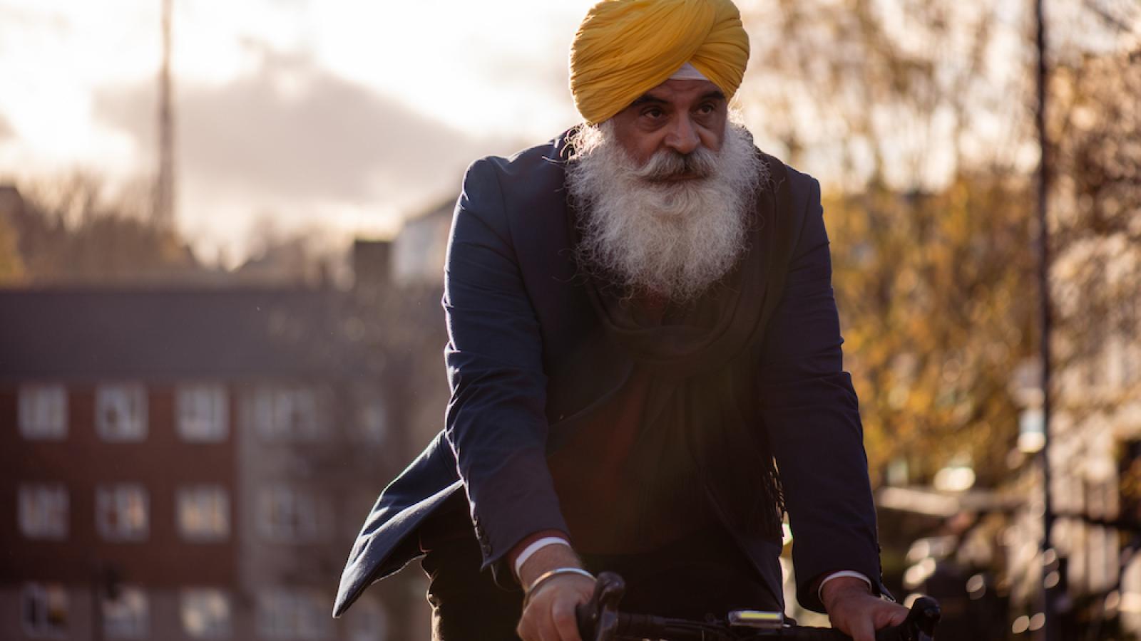 Man riding on bike on street