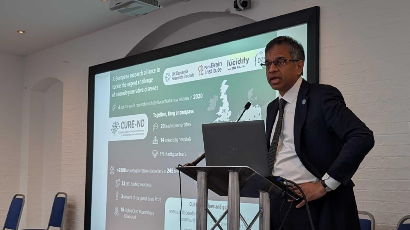 Siddharthan Chandran speaking at the CURE-ND AI symposium