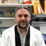 Alberto Pascual, male with grey hair wearing a lab coat