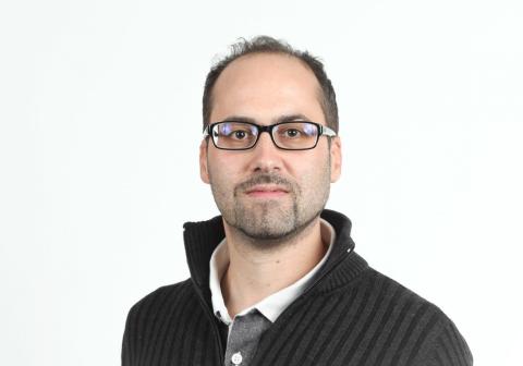 Headshot of Carlo Sala Frigerio, male with dark hair, glasses, and grey facial hair