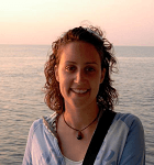 Emily Rocha, young woman with curly hair against sunset background