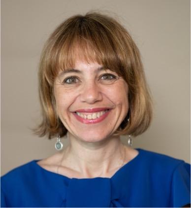 Smiling female with short, dark blonde hair and a straight fringe 