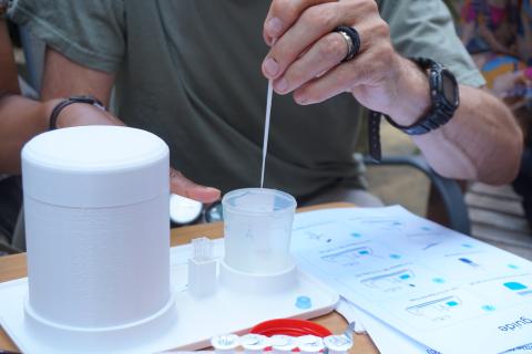Image showing a scientist using a pipette