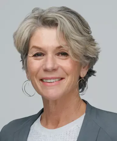 Headshot of Giovanna Mallucci, female with short grey hair