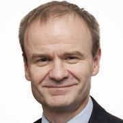 Male with light brown hair, smiling