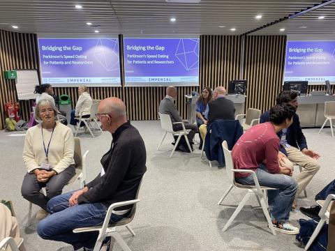 People sit in small groups at a speed networking event