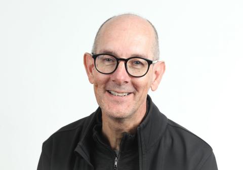 Headshot of Paul Whiting, male with glasses