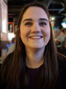 Smiling female with long dark brown hair 