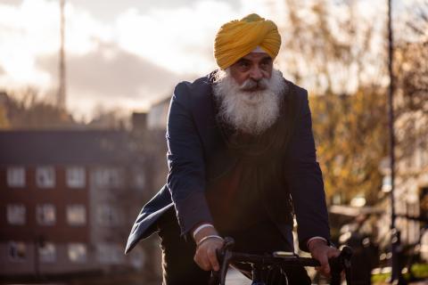 Man riding on bike on street