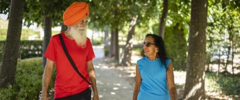 2 people walking in the park