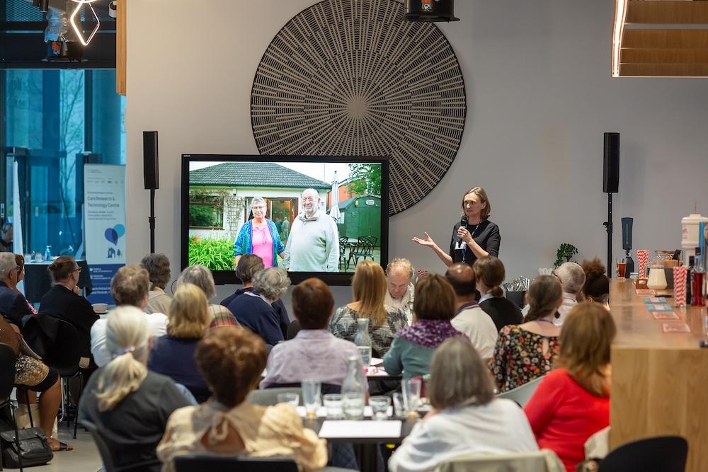 Room of people watching presentation