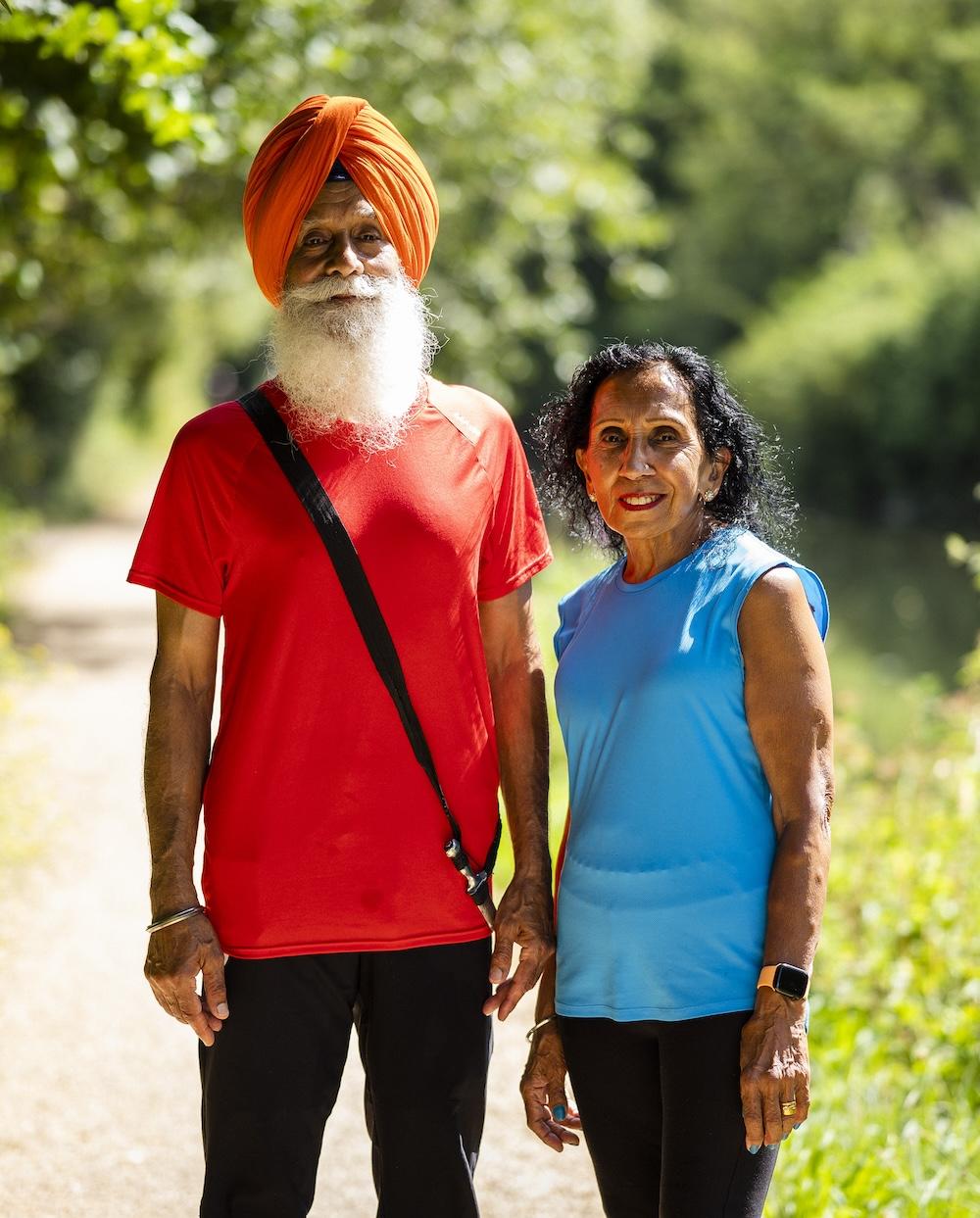 Couple standing outside in the sun portrait