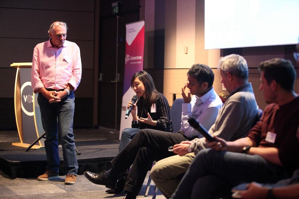 Scientists chatting at a panel at connectome