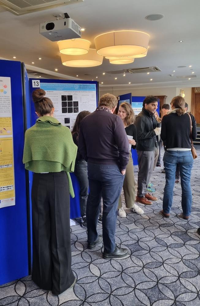 Researchers at a poster session